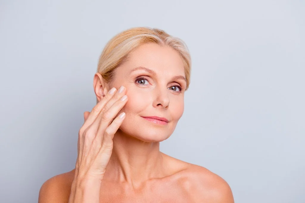 Close-up portrait highlighting refined skin texture and tone